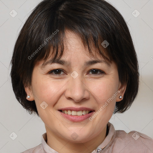 Joyful white adult female with medium  brown hair and brown eyes