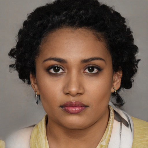 Neutral black young-adult female with long  brown hair and brown eyes