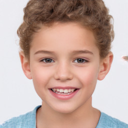 Joyful white child male with short  brown hair and brown eyes