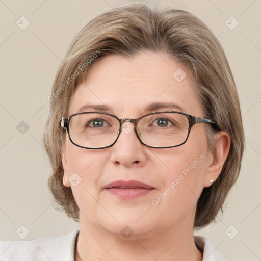 Joyful white adult female with medium  brown hair and blue eyes