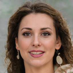 Joyful white young-adult female with medium  brown hair and green eyes