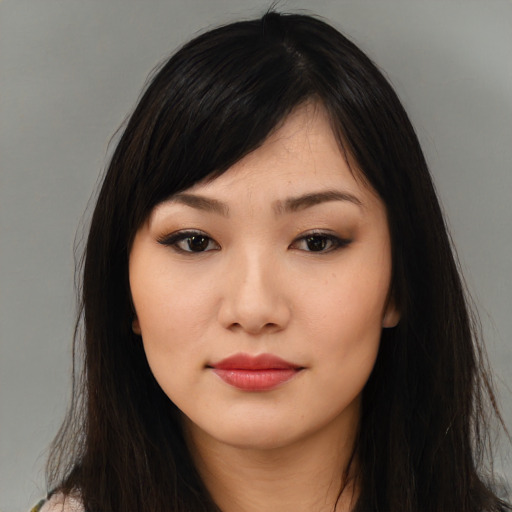 Neutral asian young-adult female with long  brown hair and brown eyes