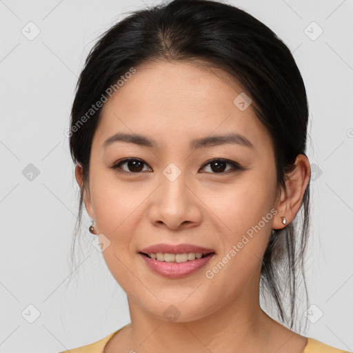 Joyful asian young-adult female with medium  brown hair and brown eyes