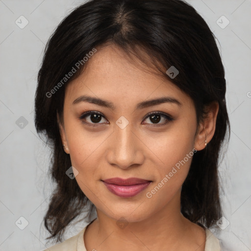 Joyful latino young-adult female with medium  brown hair and brown eyes