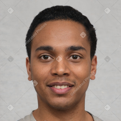 Joyful black young-adult male with short  black hair and brown eyes