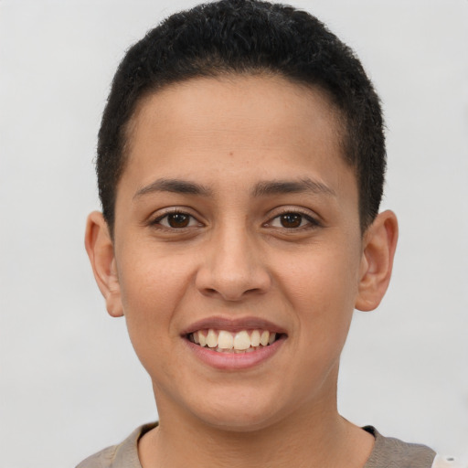 Joyful latino young-adult female with short  brown hair and brown eyes