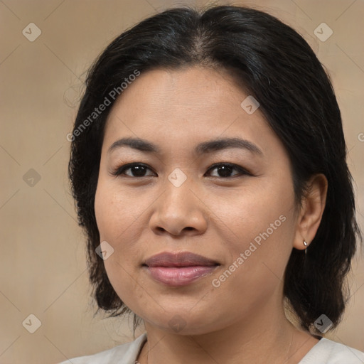 Joyful asian adult female with medium  brown hair and brown eyes