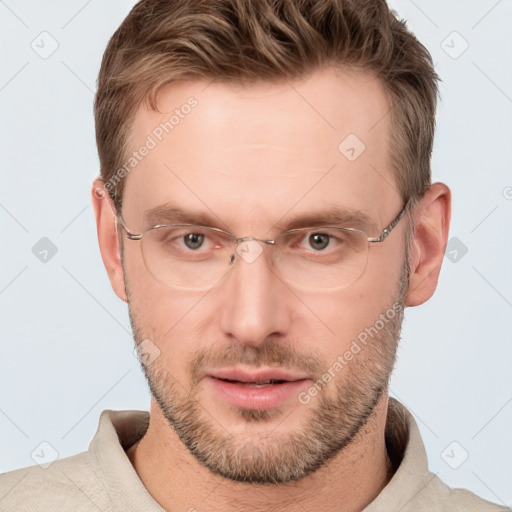 Joyful white adult male with short  brown hair and grey eyes