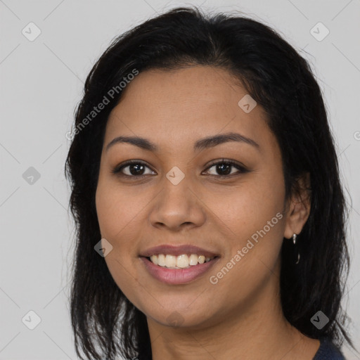 Joyful latino young-adult female with long  brown hair and brown eyes