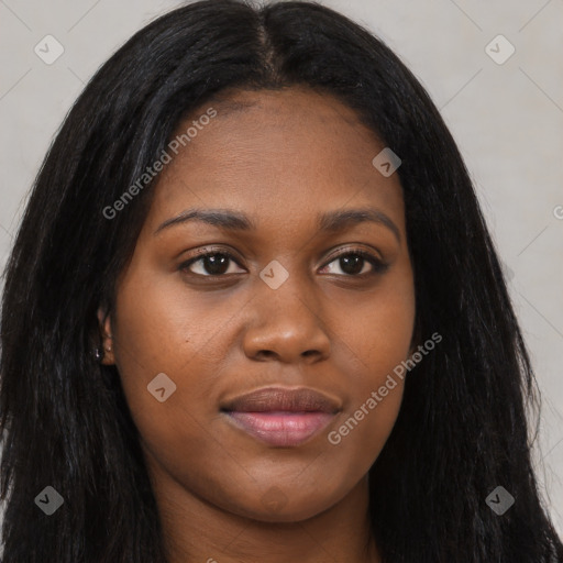 Joyful black young-adult female with long  brown hair and brown eyes