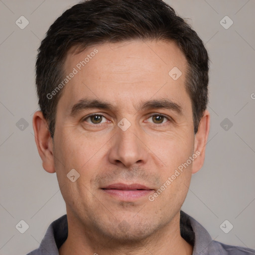 Joyful white adult male with short  brown hair and brown eyes