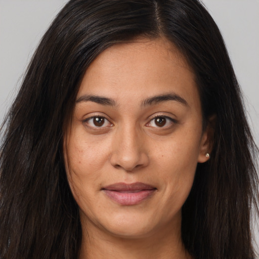 Joyful asian young-adult female with long  brown hair and brown eyes