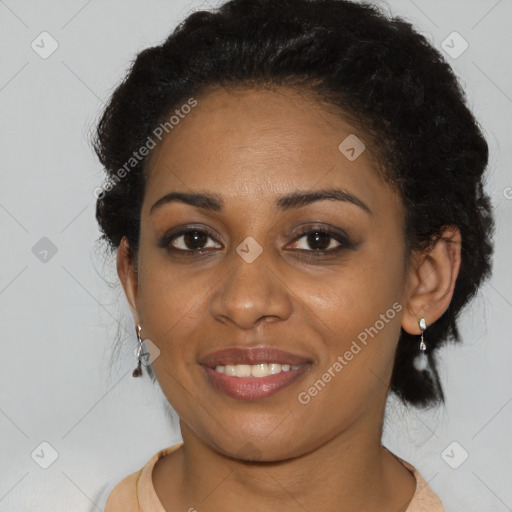 Joyful black young-adult female with short  brown hair and brown eyes