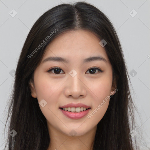 Joyful asian young-adult female with long  brown hair and brown eyes