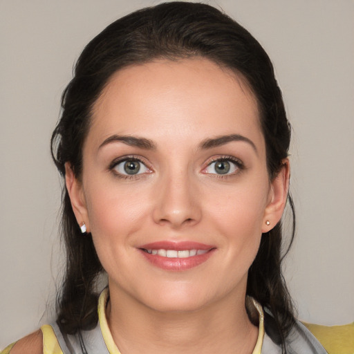 Joyful white young-adult female with medium  brown hair and brown eyes