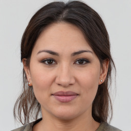 Joyful white young-adult female with medium  brown hair and brown eyes