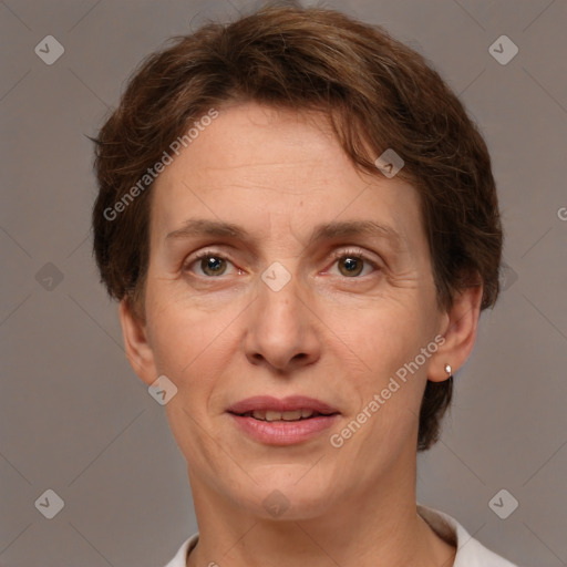 Joyful white adult female with short  brown hair and brown eyes