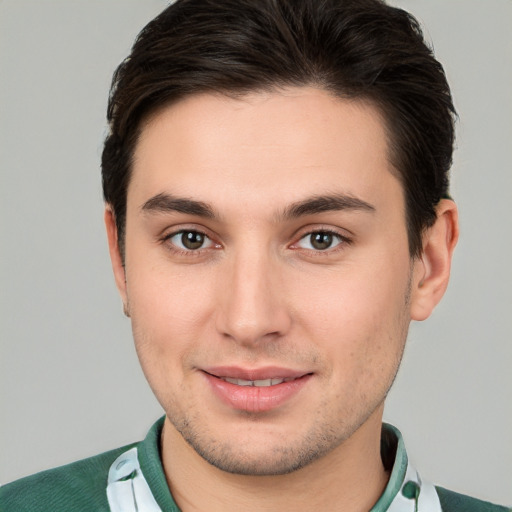 Joyful white young-adult male with short  brown hair and brown eyes