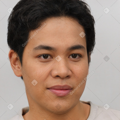 Joyful latino young-adult male with short  brown hair and brown eyes