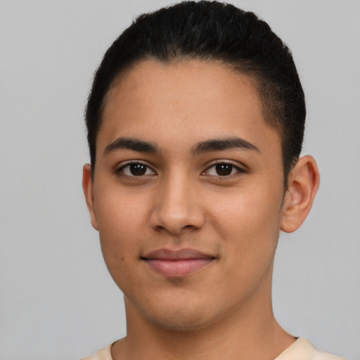 Joyful latino young-adult male with short  black hair and brown eyes