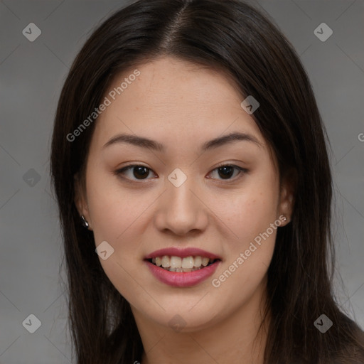 Joyful asian young-adult female with long  brown hair and brown eyes