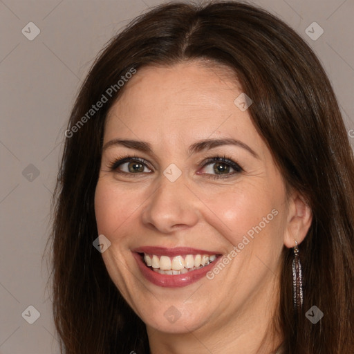 Joyful white adult female with long  brown hair and brown eyes