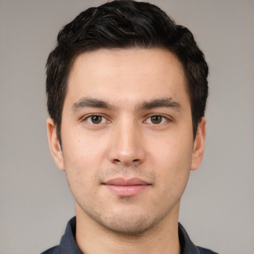 Neutral white young-adult male with short  black hair and brown eyes