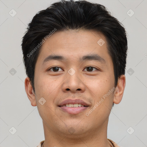 Joyful asian young-adult male with short  brown hair and brown eyes