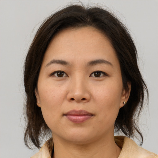 Neutral asian young-adult female with medium  brown hair and brown eyes