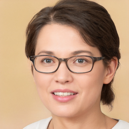 Joyful white young-adult female with medium  brown hair and brown eyes