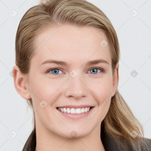 Joyful white young-adult female with long  brown hair and blue eyes