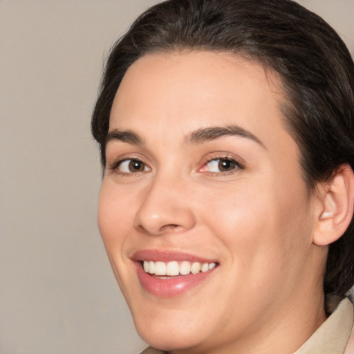 Joyful white young-adult female with medium  brown hair and brown eyes