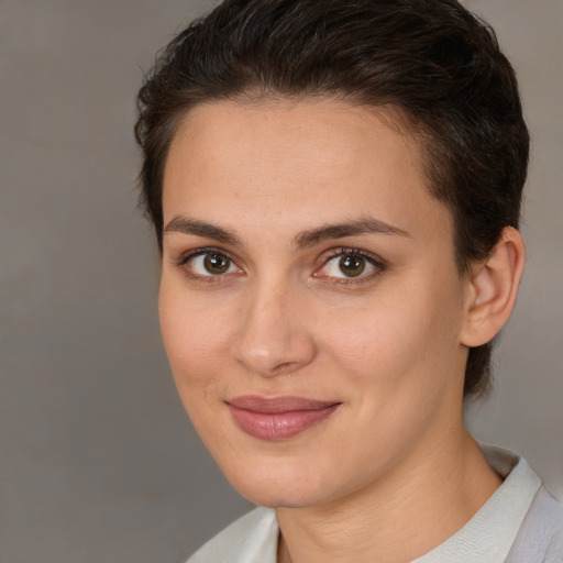 Joyful white young-adult female with medium  brown hair and brown eyes