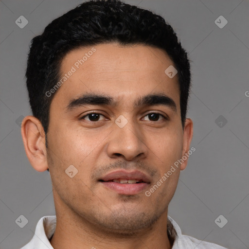 Joyful latino young-adult male with short  black hair and brown eyes