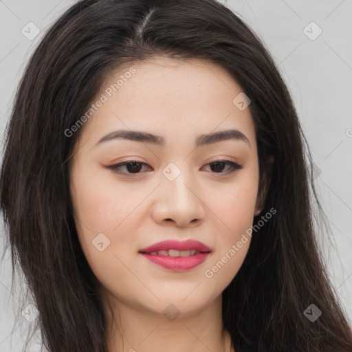 Joyful asian young-adult female with long  brown hair and brown eyes