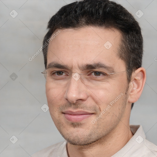 Joyful white adult male with short  brown hair and brown eyes