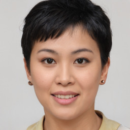 Joyful asian young-adult female with short  brown hair and brown eyes