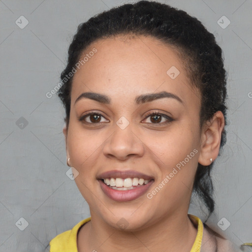 Joyful latino young-adult female with short  brown hair and brown eyes