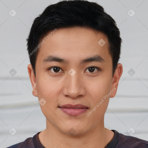 Joyful asian young-adult male with short  black hair and brown eyes