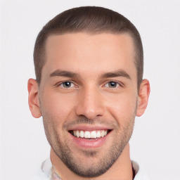 Joyful white young-adult male with short  brown hair and brown eyes