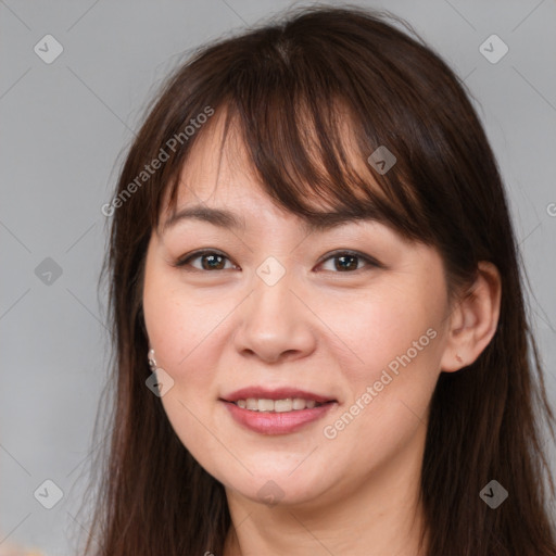 Joyful white young-adult female with long  brown hair and brown eyes