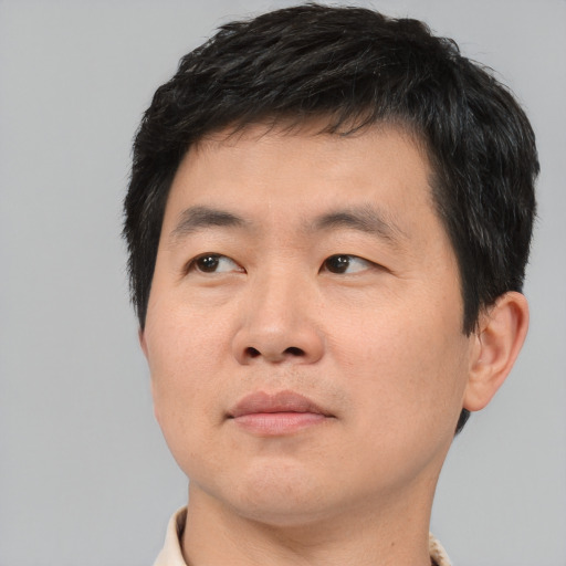 Neutral asian young-adult male with short  brown hair and brown eyes
