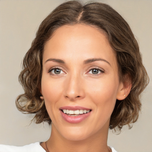 Joyful white young-adult female with medium  brown hair and brown eyes