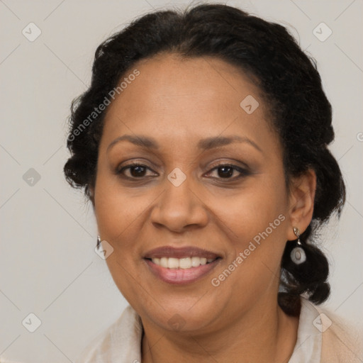 Joyful black adult female with medium  brown hair and brown eyes