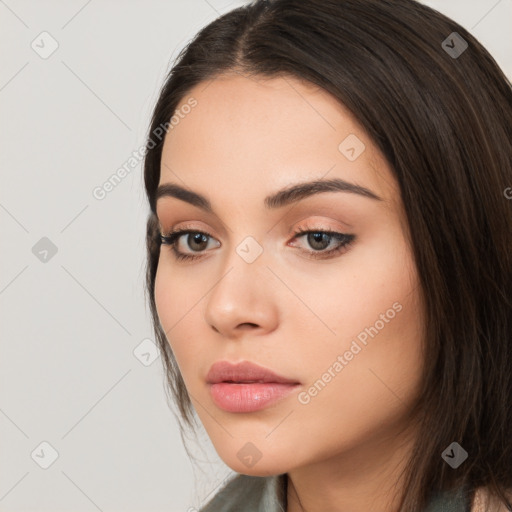 Neutral white young-adult female with long  brown hair and brown eyes