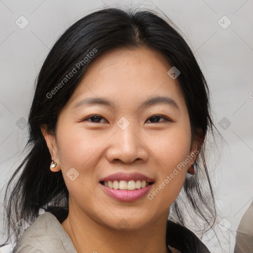 Joyful asian young-adult female with medium  brown hair and brown eyes