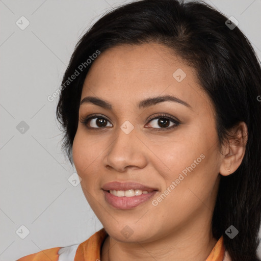 Joyful latino young-adult female with medium  brown hair and brown eyes