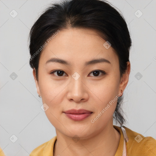 Joyful asian young-adult female with short  brown hair and brown eyes