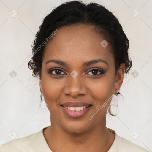 Joyful black young-adult female with long  black hair and brown eyes