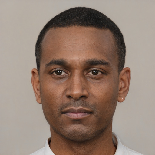 Neutral black young-adult male with short  black hair and brown eyes